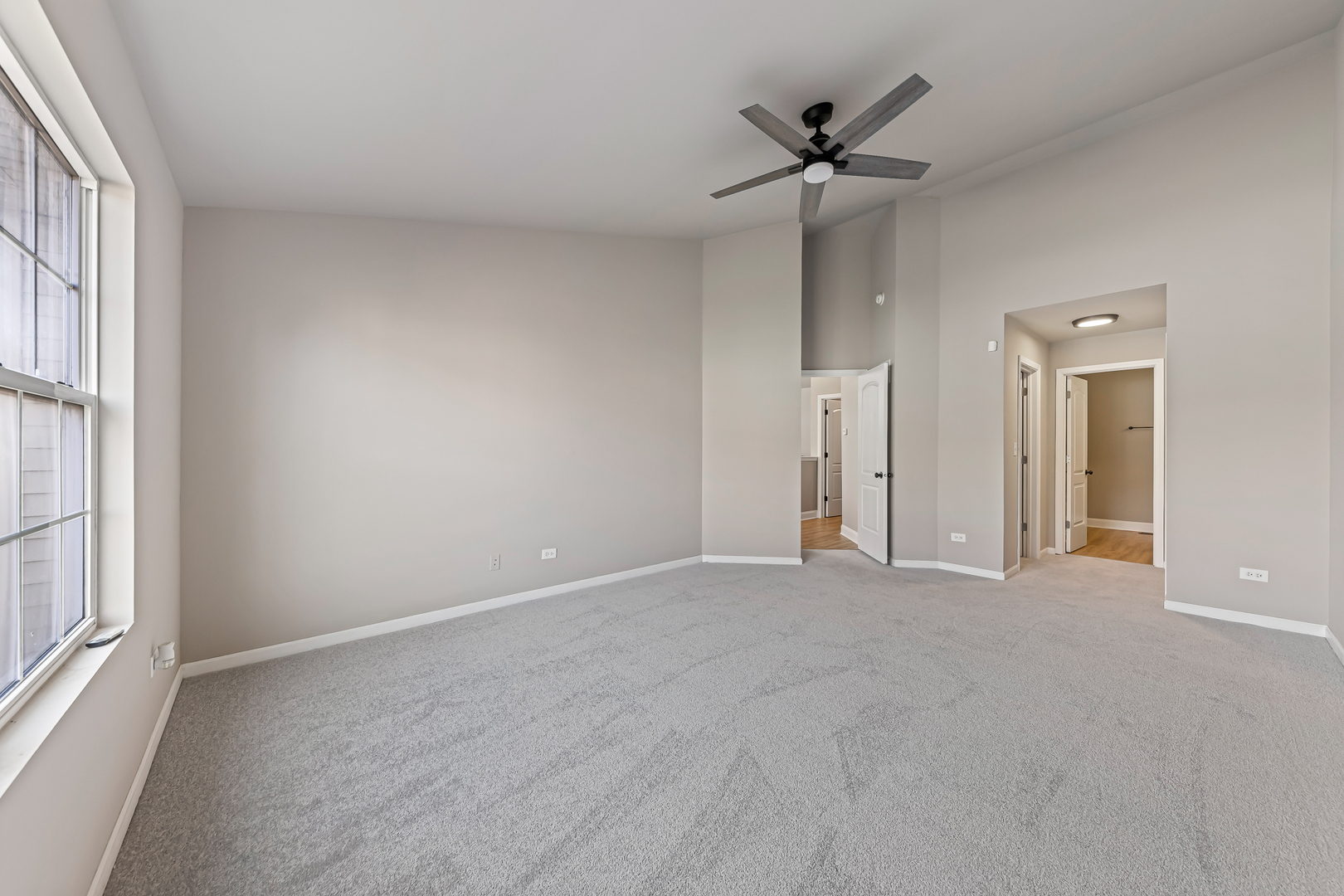 6006 West Carter Court Monee, IL 60449 - Photo 8 of 15 a view of an empty room with a ceiling fan and window