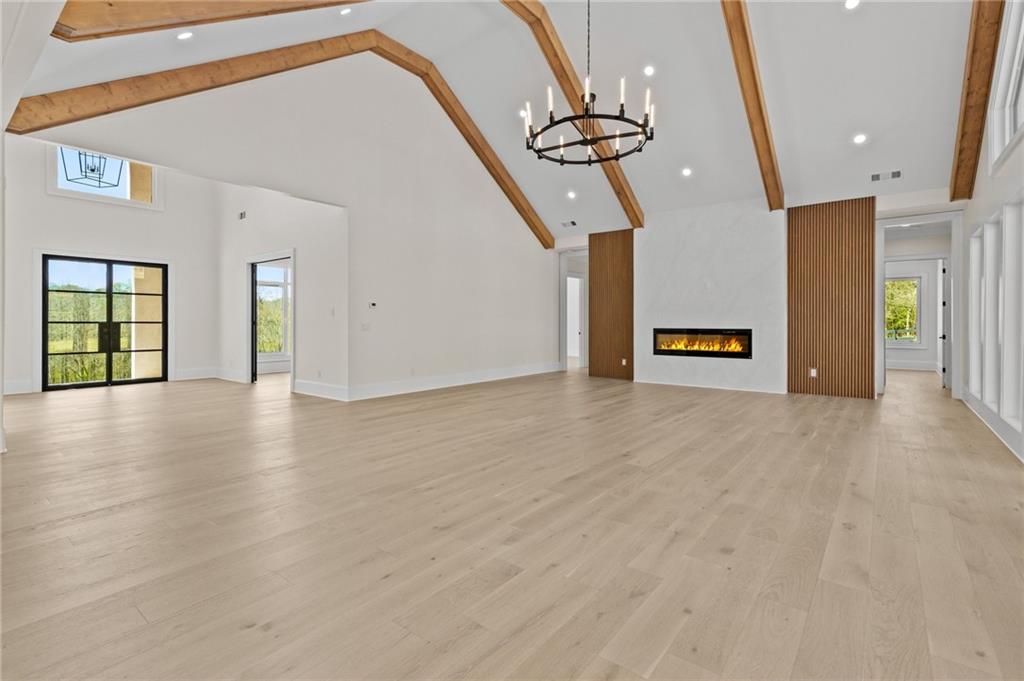 4521 Jack Pittman Road Monroe, GA 30656 - Photo 11 of 78 an empty room with stairs and wooden floor