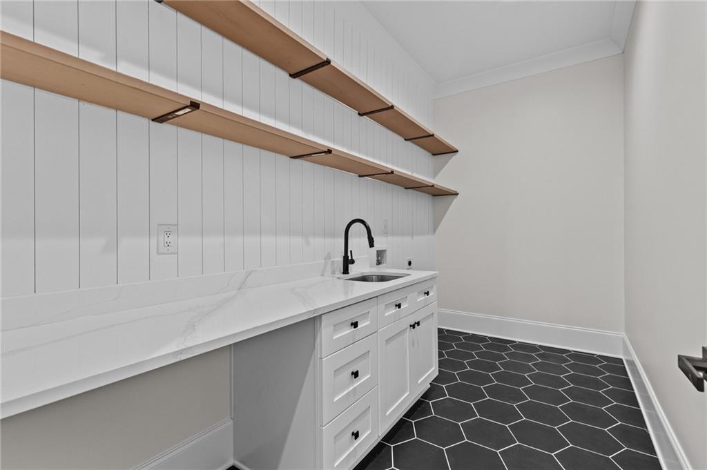 4521 Jack Pittman Road Monroe, GA 30656 - Photo 15 of 78 a kitchen with a sink and cabinets