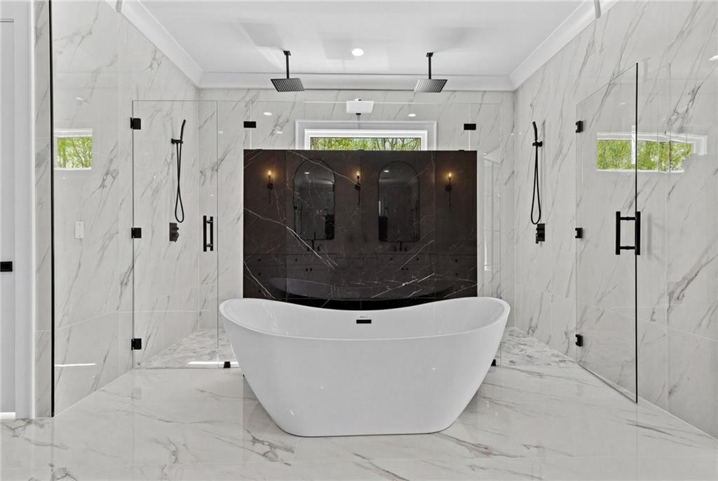 4521 Jack Pittman Road Monroe, GA 30656 - Photo 29 of 78 a bathroom with a bathtub and a shower