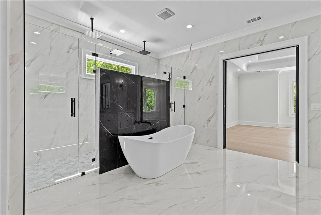 4521 Jack Pittman Road Monroe, GA 30656 - Photo 31 of 78 a spacious bathroom with a shower and a tub