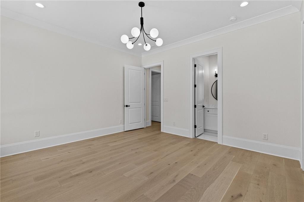 4521 Jack Pittman Road Monroe, GA 30656 - Photo 40 of 78 a view of an empty room with wooden floor