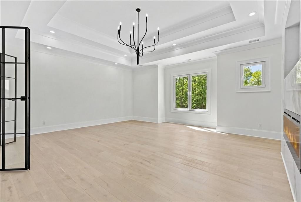 4521 Jack Pittman Road Monroe, GA 30656 - Photo 48 of 78 an empty room with windows and ceiling fan