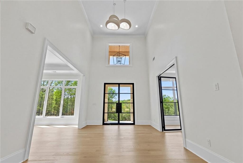 4521 Jack Pittman Road Monroe, GA 30656 - Photo 5 of 78 wooden floor in an empty room with a window