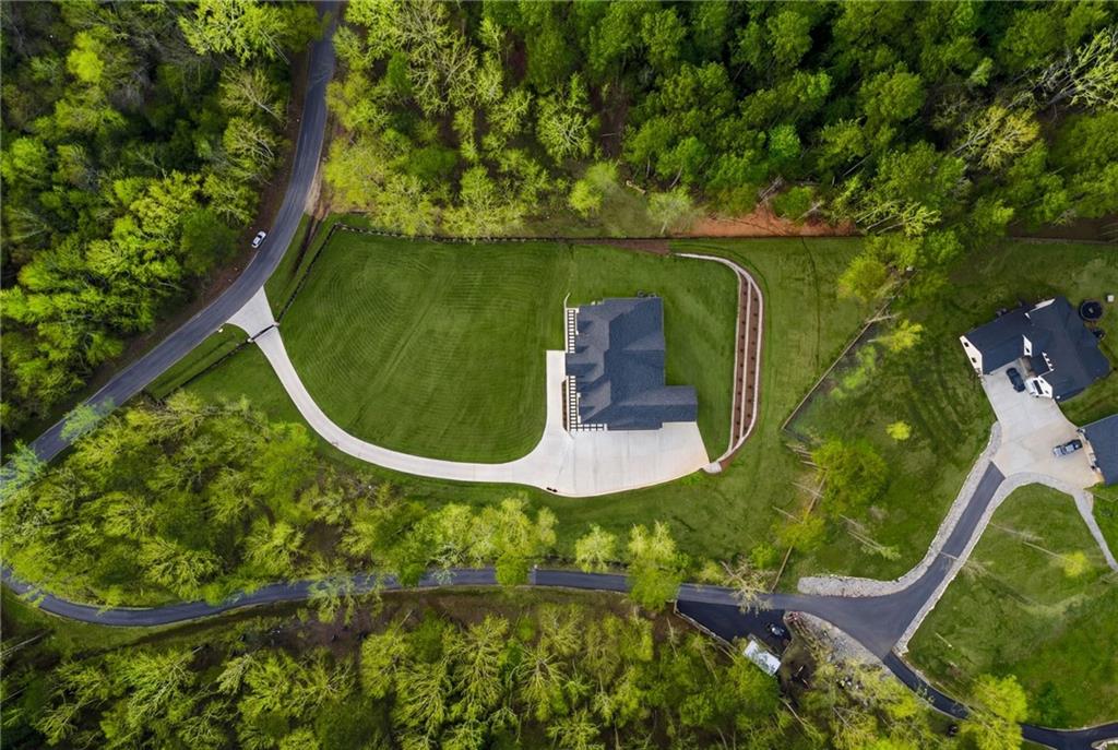 4521 Jack Pittman Road Monroe, GA 30656 - Photo 76 of 78 an aerial view of a golf course with swimming pool