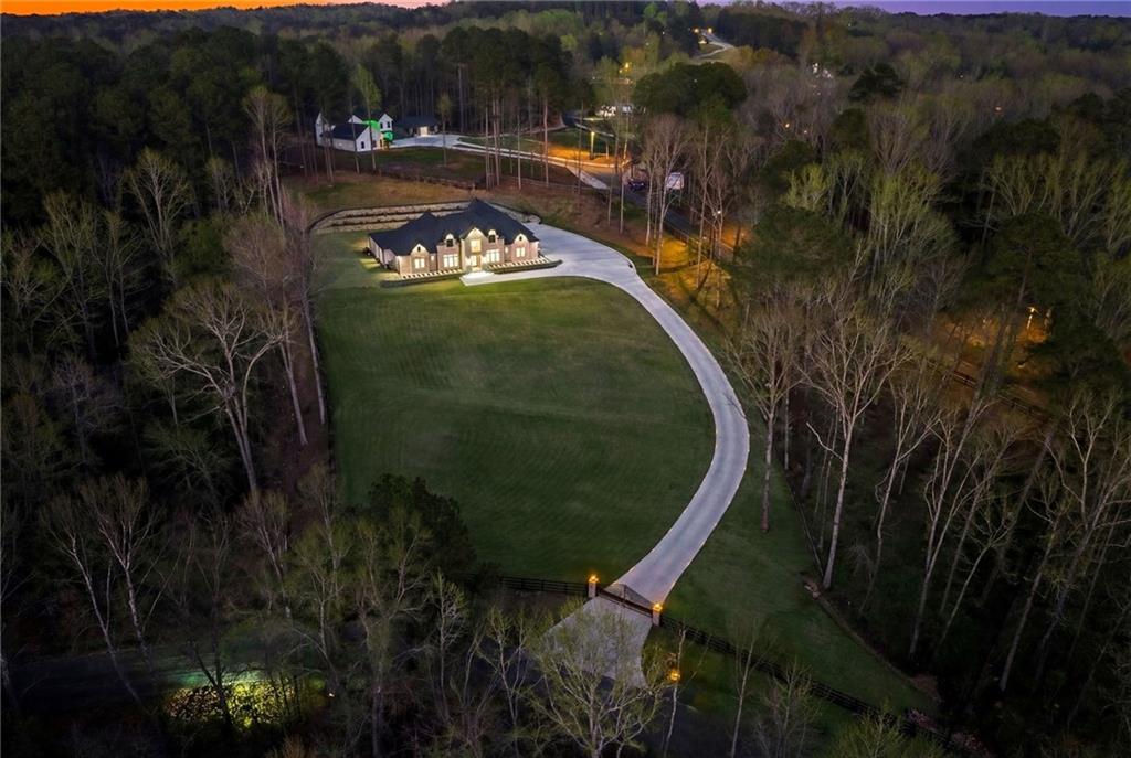 4521 Jack Pittman Road Monroe, GA 30656 - Photo 77 of 78 a view of a swimming pool of water with a house in the background
