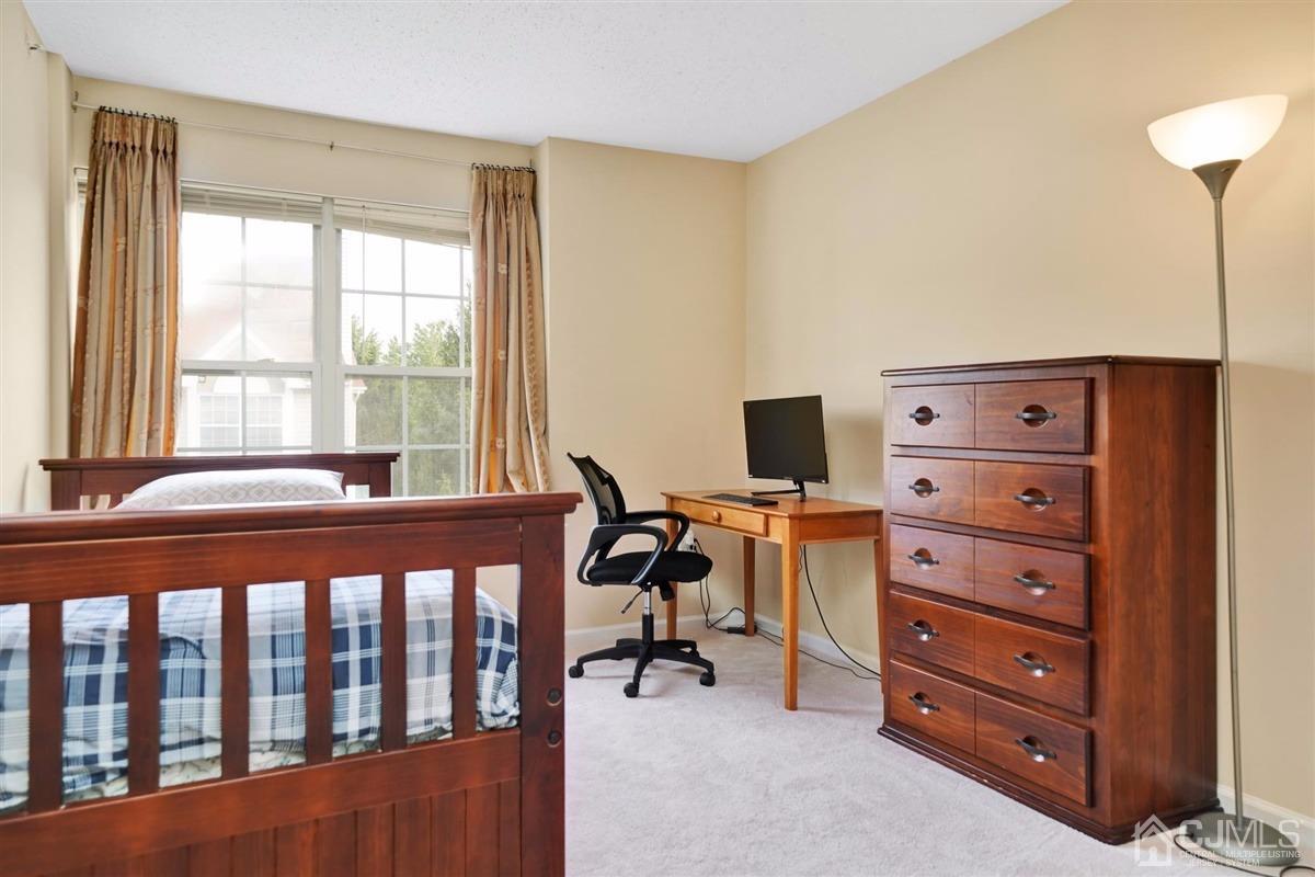 1 Prestwick Way, Unit 1 Edison, NJ 08820 - Photo 18 of 24 a view of a workspace with furniture and a window