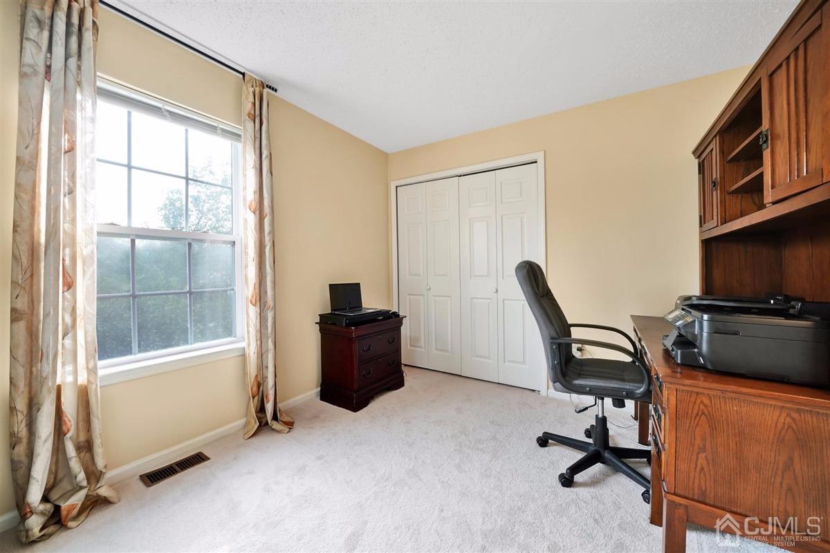 1 Prestwick Way, Unit 1 Edison, NJ 08820 - Photo 19 of 24 a view of a workspace with furniture and a window