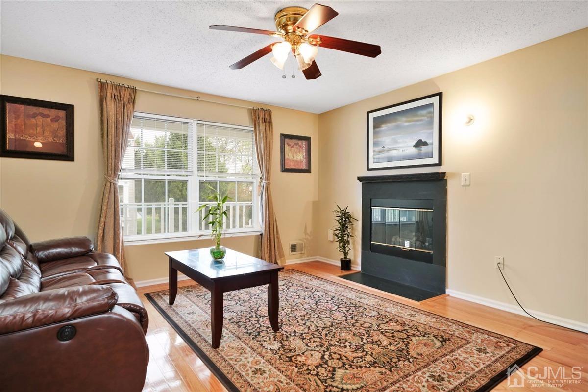 1 Prestwick Way, Unit 1 Edison, NJ 08820 - Photo 4 of 24 a living room with furniture and a window
