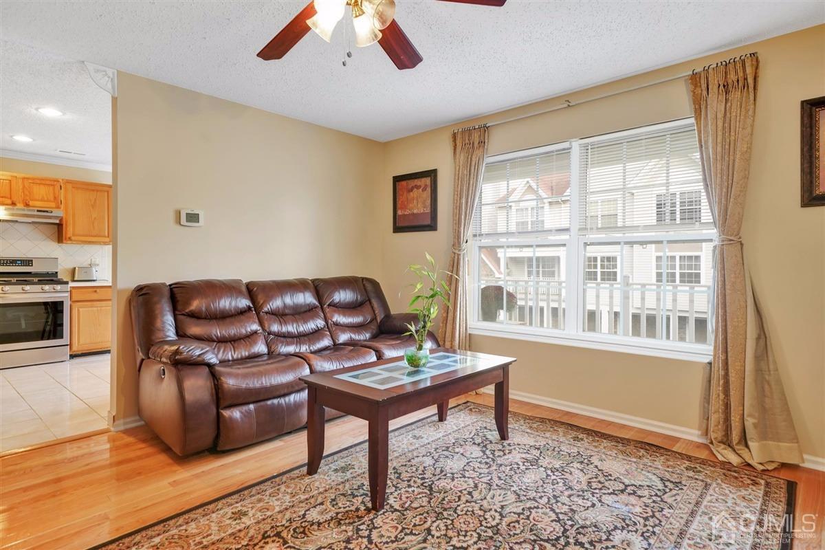 1 Prestwick Way, Unit 1 Edison, NJ 08820 - Photo 6 of 24 a living room with furniture and a window