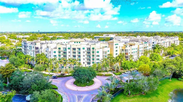 a view of a flower garden with a lake