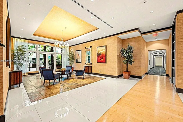 a lobby with furniture and floor to ceiling window