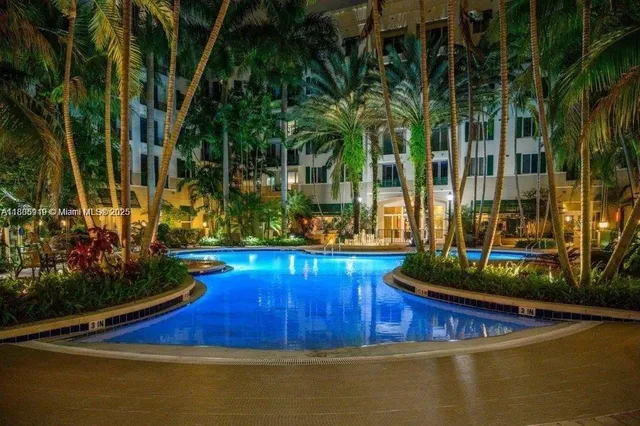 a view of swimming pool with a yard and sitting area