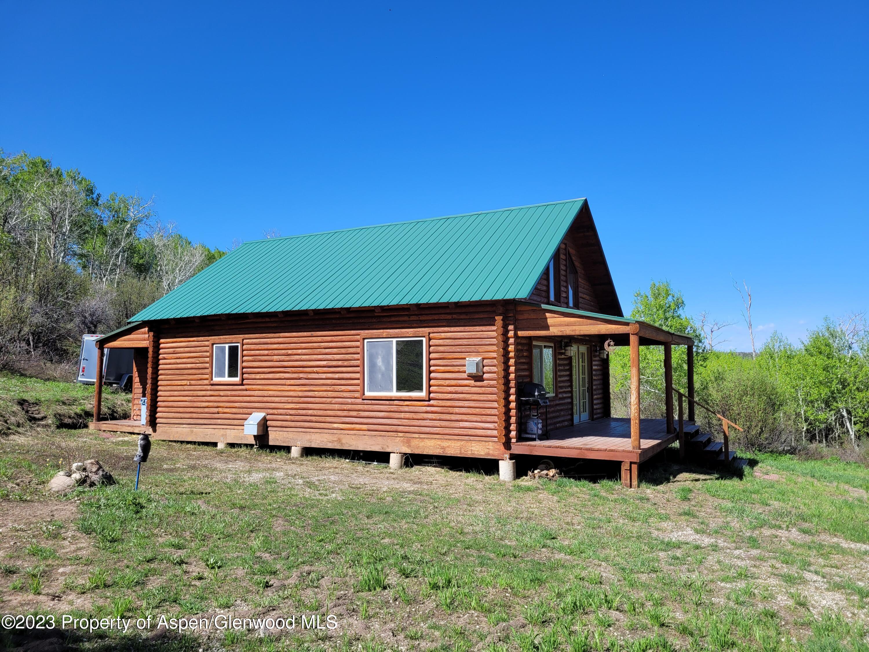 80 Sapling Lane Craig, CO 81625 - Photo 3 of 27 a front view of a house with a yard
