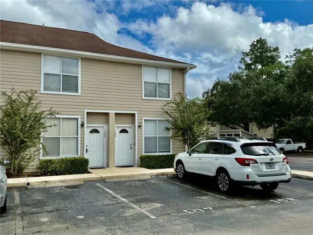 a view of a car parked in front of a house