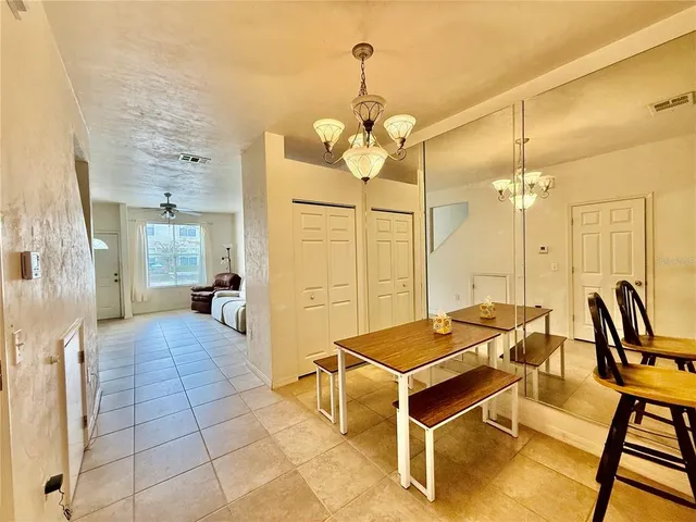 a outdoor space with lots of chairs and mirrors