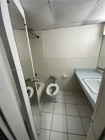a bathroom with a sink and washing machine