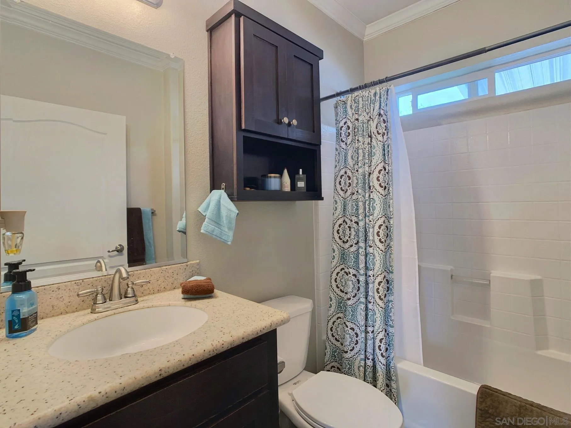 1315 Pepper Drive, Unit 2 El Cajon, CA 92021 - Photo 17 of 29 a bathroom with a granite countertop sink a toilet a mirror a vanity and shower