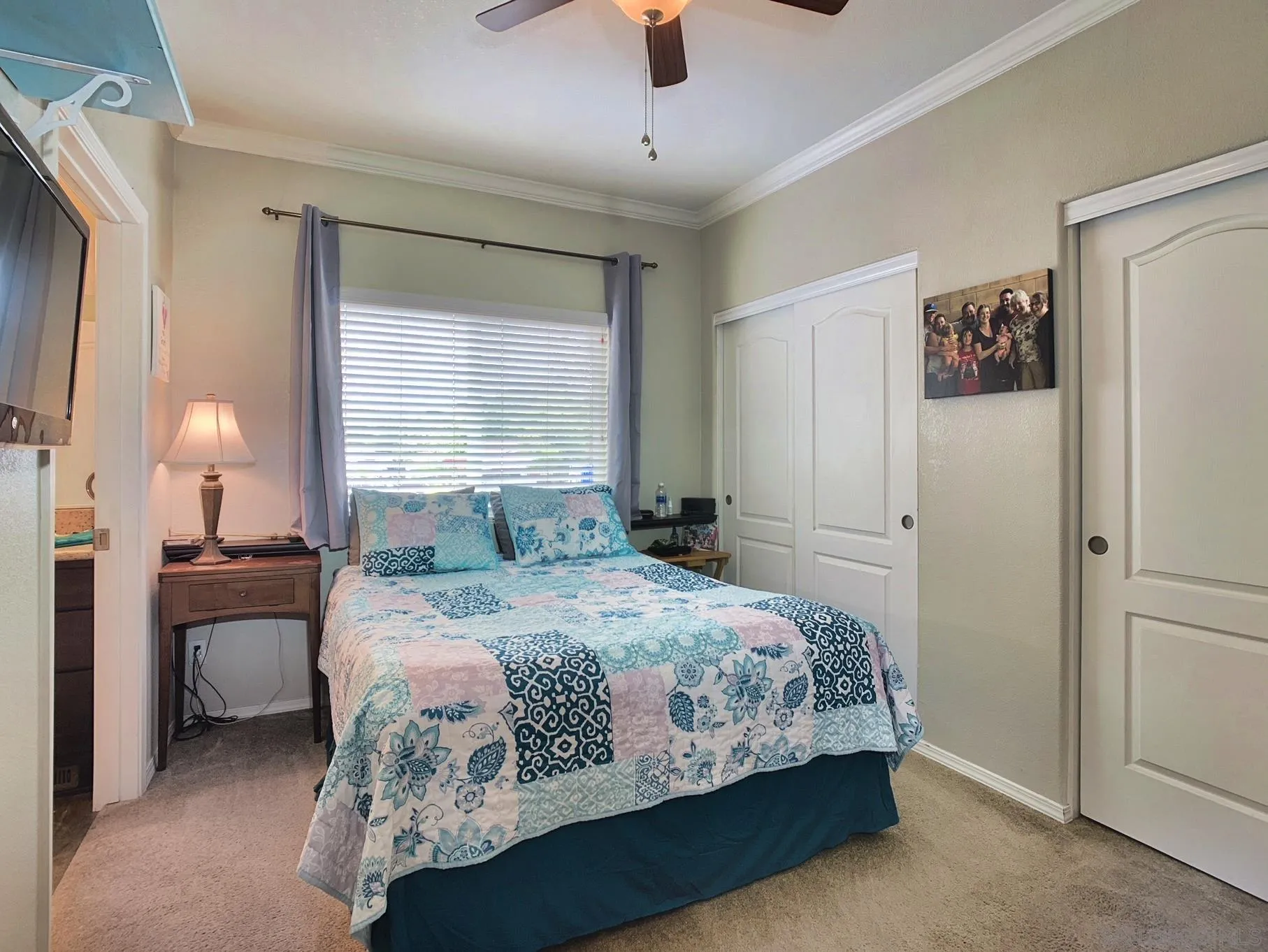 1315 Pepper Drive, Unit 2 El Cajon, CA 92021 - Photo 18 of 29 a bedroom with a bed and a chandelier