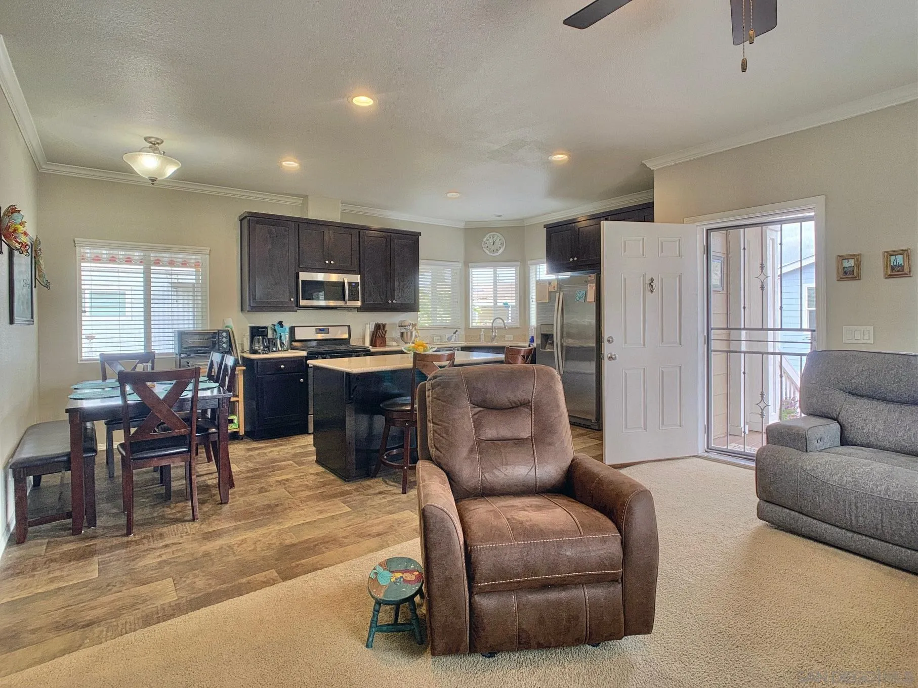 1315 Pepper Drive, Unit 2 El Cajon, CA 92021 - Photo 10 of 29 a living room with furniture a flat screen tv and kitchen view