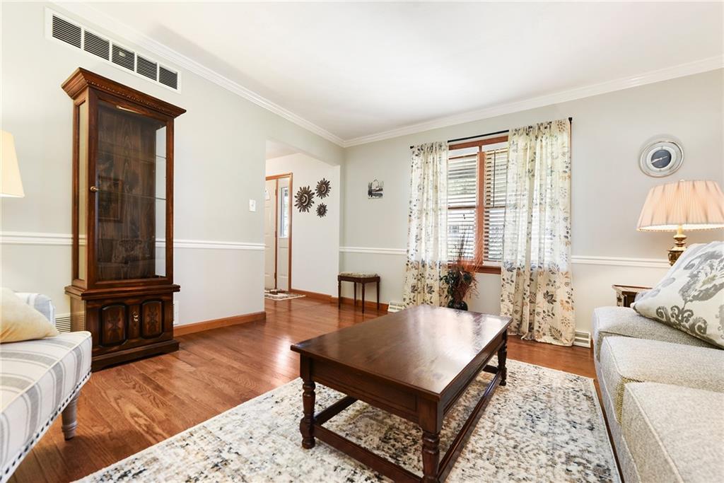1069 Redoak Drive Harrison City, PA 15636 - Photo 19 of 43 a living room with furniture and a window