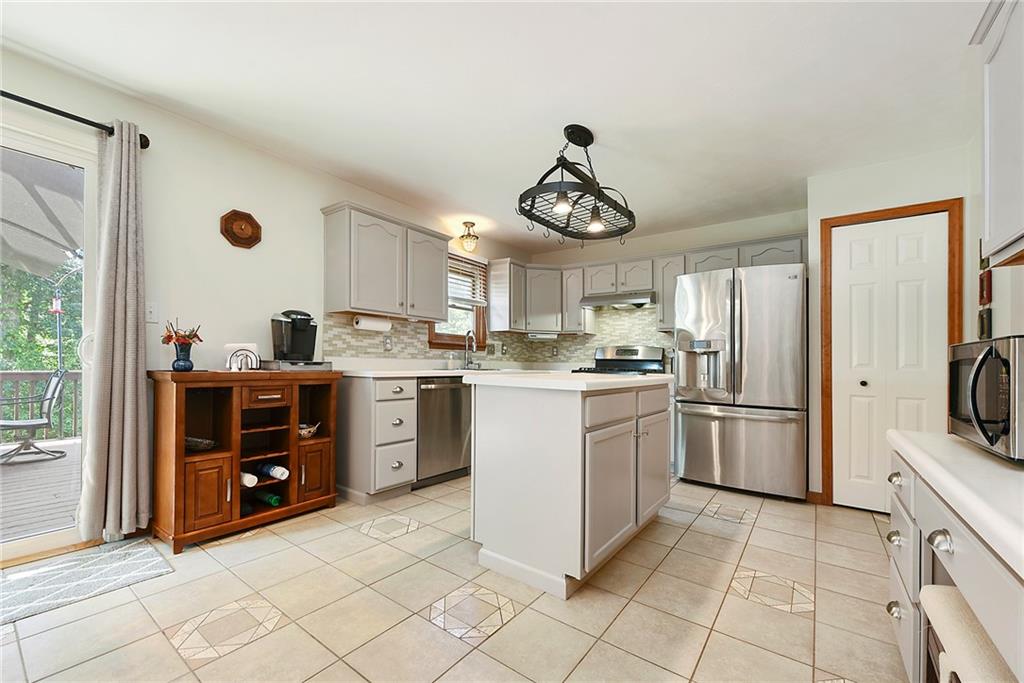 1069 Redoak Drive Harrison City, PA 15636 - Photo 9 of 43 a kitchen with appliances cabinets and furniture