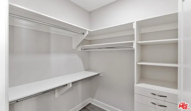 a view of an empty walk in closet