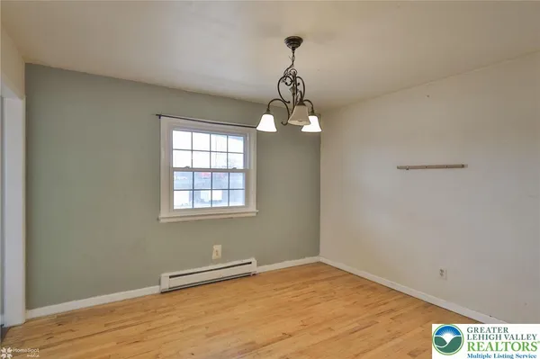 a kitchen with stainless steel appliances granite countertop a sink a stove cabinets and a refrigerator