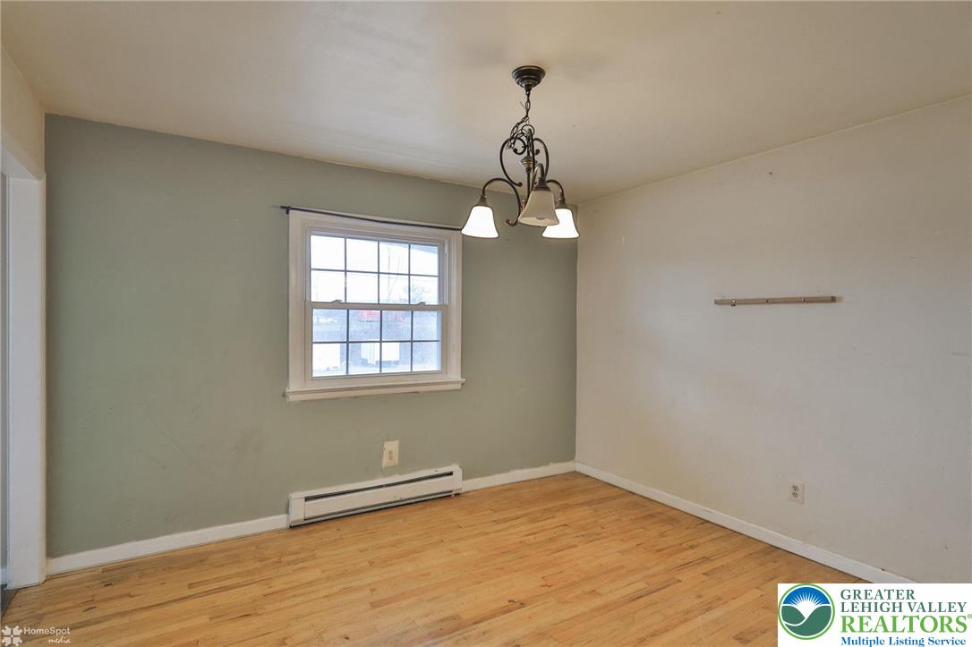 210 South 16th Street Emmaus, PA 18049 - Photo 11 of 71 a view of an empty room with wooden floor and a window