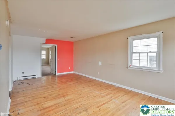 a view of an empty room with a window