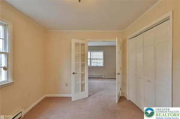 a bathroom with a sink vanity granite tub shower and a mirror