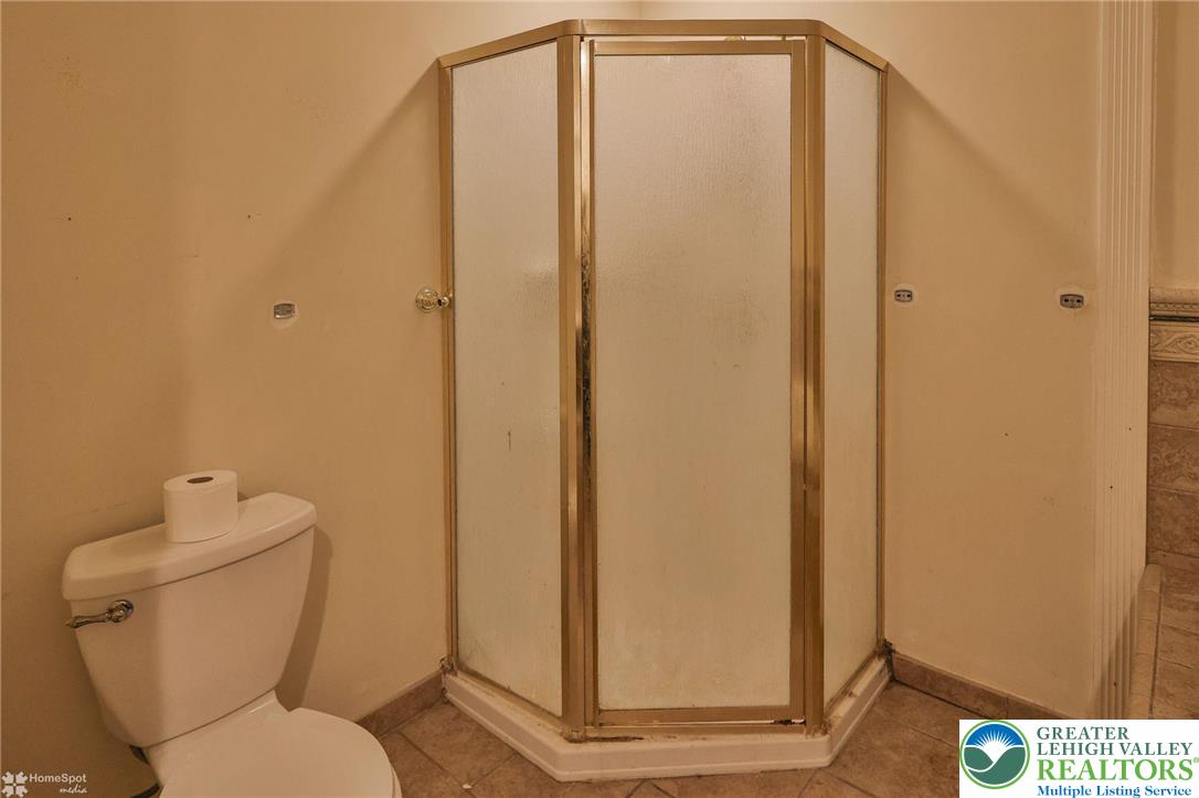 210 South 16th Street Emmaus, PA 18049 - Photo 37 of 71 a bathroom with a toilet and a shower