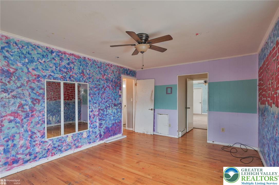210 South 16th Street Emmaus, PA 18049 - Photo 39 of 71 a view of an empty room with a window and a ceiling fan