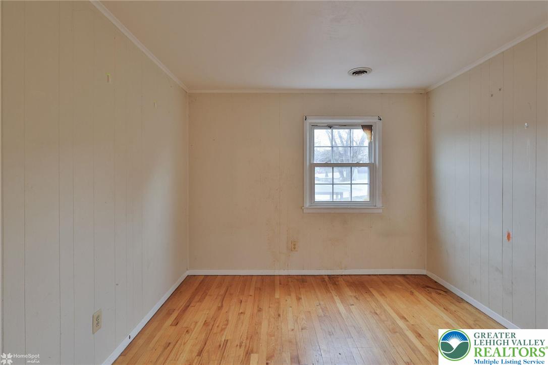 210 South 16th Street Emmaus, PA 18049 - Photo 46 of 71 an empty room with wooden floor and windows