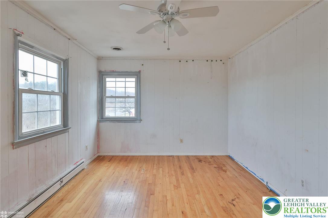 210 South 16th Street Emmaus, PA 18049 - Photo 51 of 71 an empty room with a window and wooden floor
