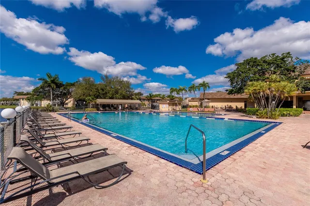 a view of a swimming pool with a patio