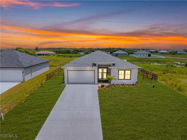 a view of a big house with a big yard