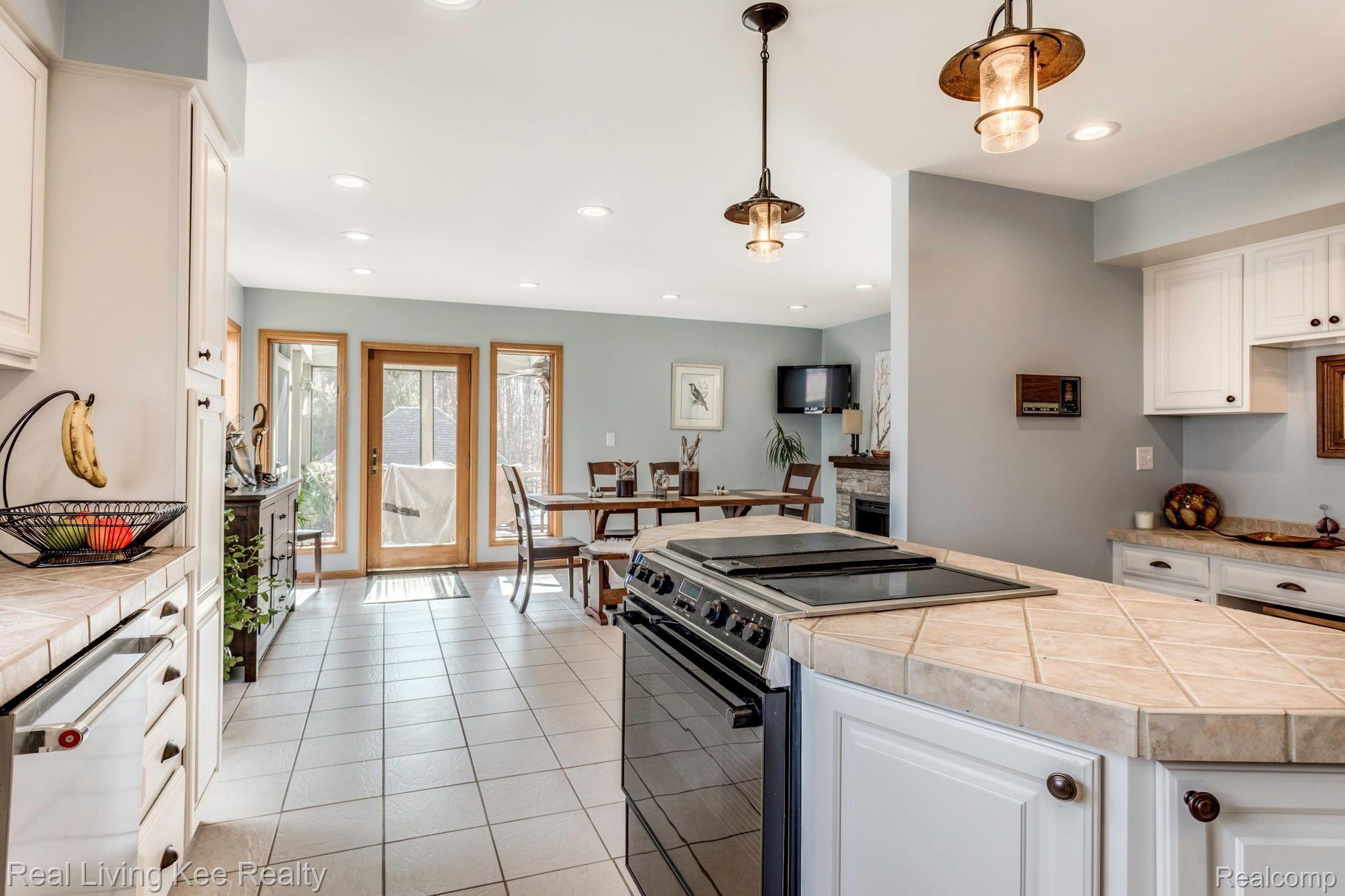 5775 McIntyre Road North Street, MI 48049 - Photo 19 of 65 5775 McIntyre Rd. kitchen through to kitchen eating area from north wall of kitchen which is adjacent to garage.JPG