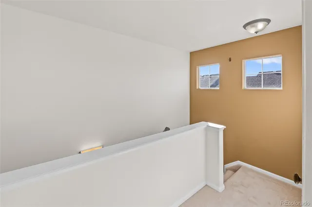 a room with wooden cabinet and a window