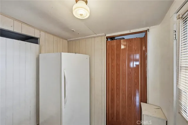 a white refrigerator freezer sitting inside of a kitchen