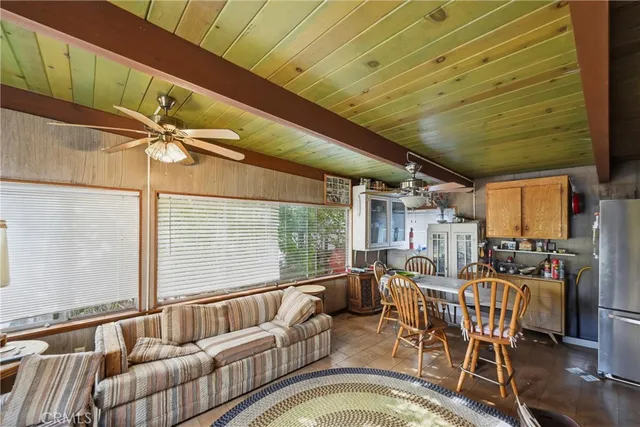 a living room with lots of furniture and a chandelier