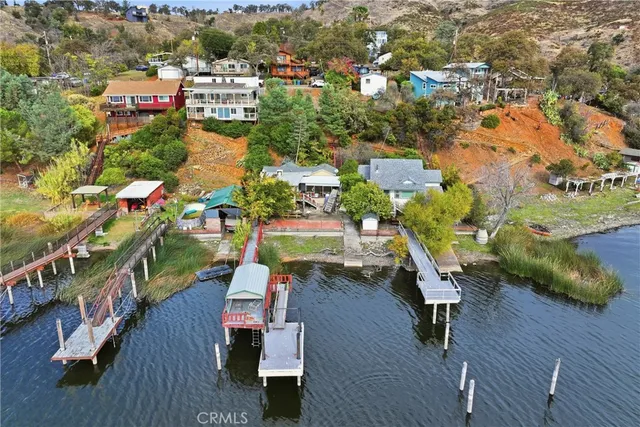 an aerial view of a house with a yard pool patio and outdoor seating