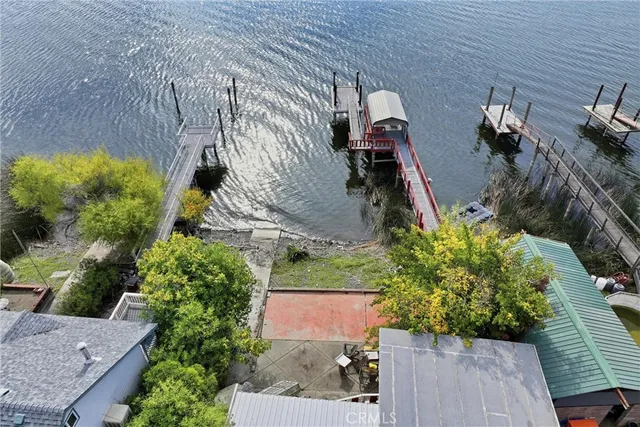 an aerial view of a house with a yard and potted plants