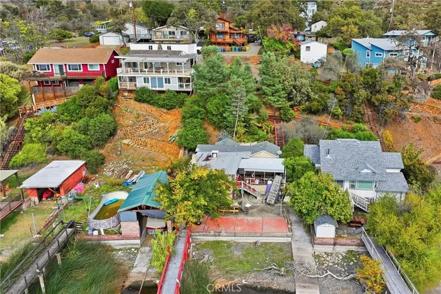 an aerial view of multiple houses with yard