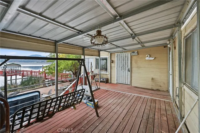a view of a balcony with wooden floor