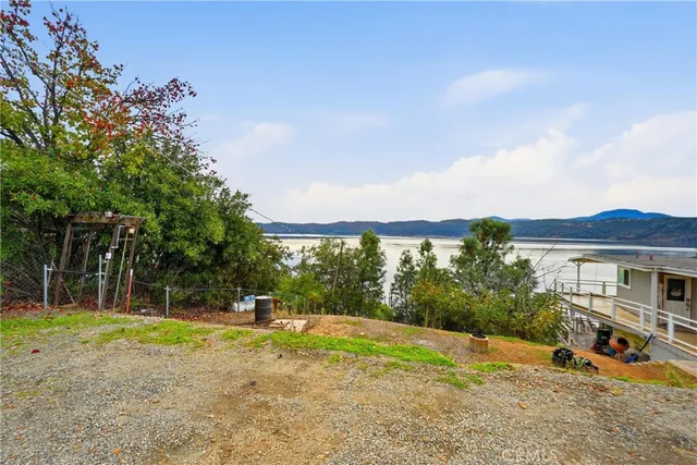 a view of swimming pool and trees in the background