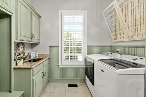 a kitchen with a sink and a stove top oven