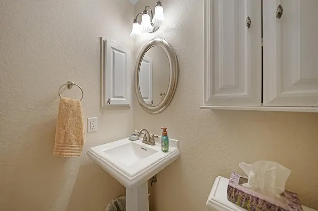 a bathroom with a sink and a mirror