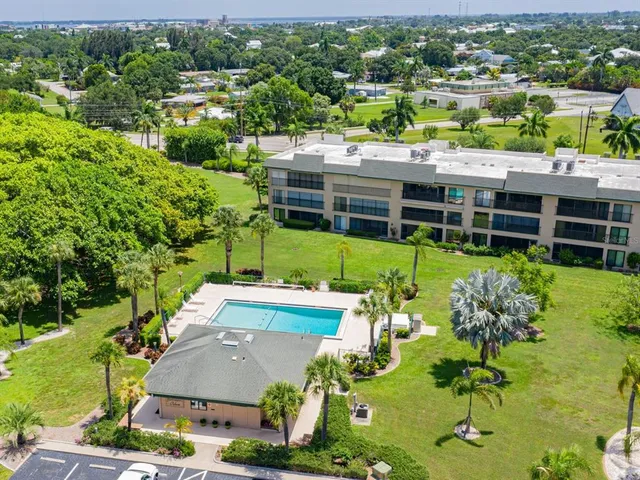 an aerial view of a house with a lake view