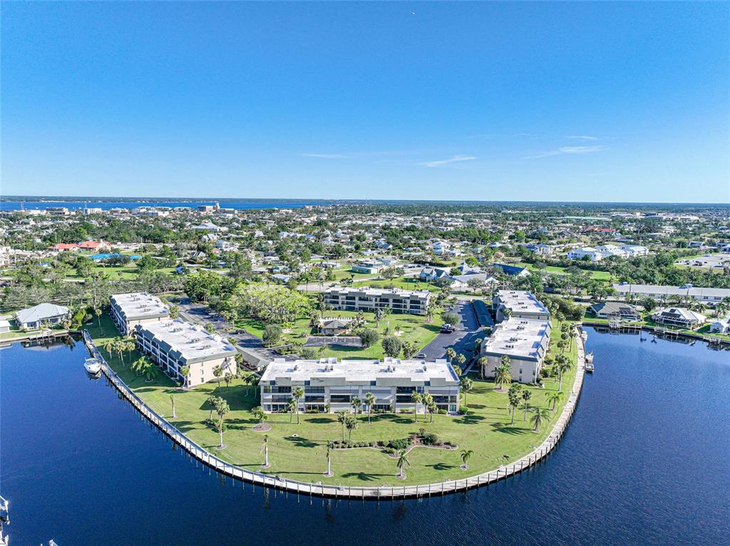 601 Shreve Street, Unit 42C Punta Gorda, FL 33950 - Photo 38 of 39 a view of a swimming pool with outdoor seating and yard in back